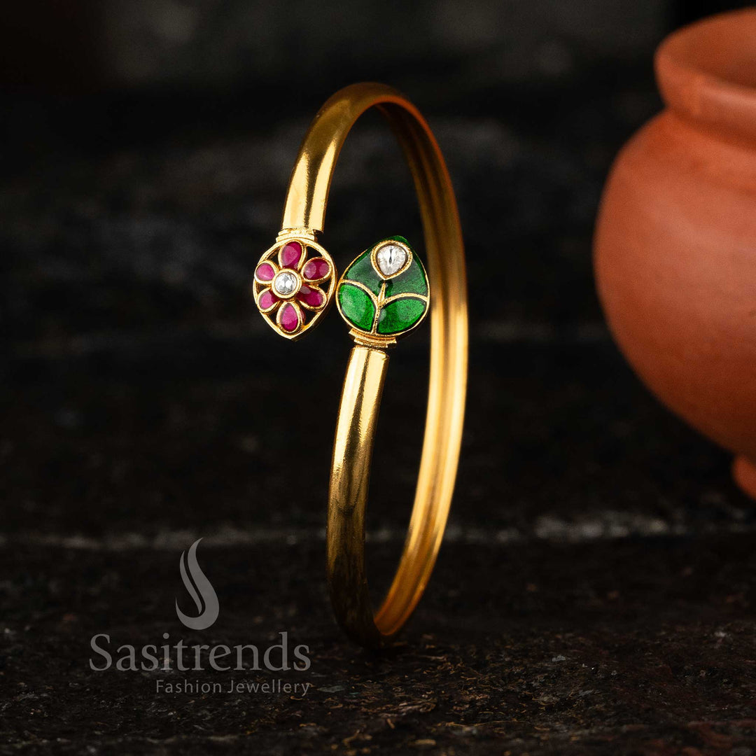 Elegant matte gold Kundan kada bangle with red and green floral enamel detailing, perfect for traditional and modern styles - Sasitrends