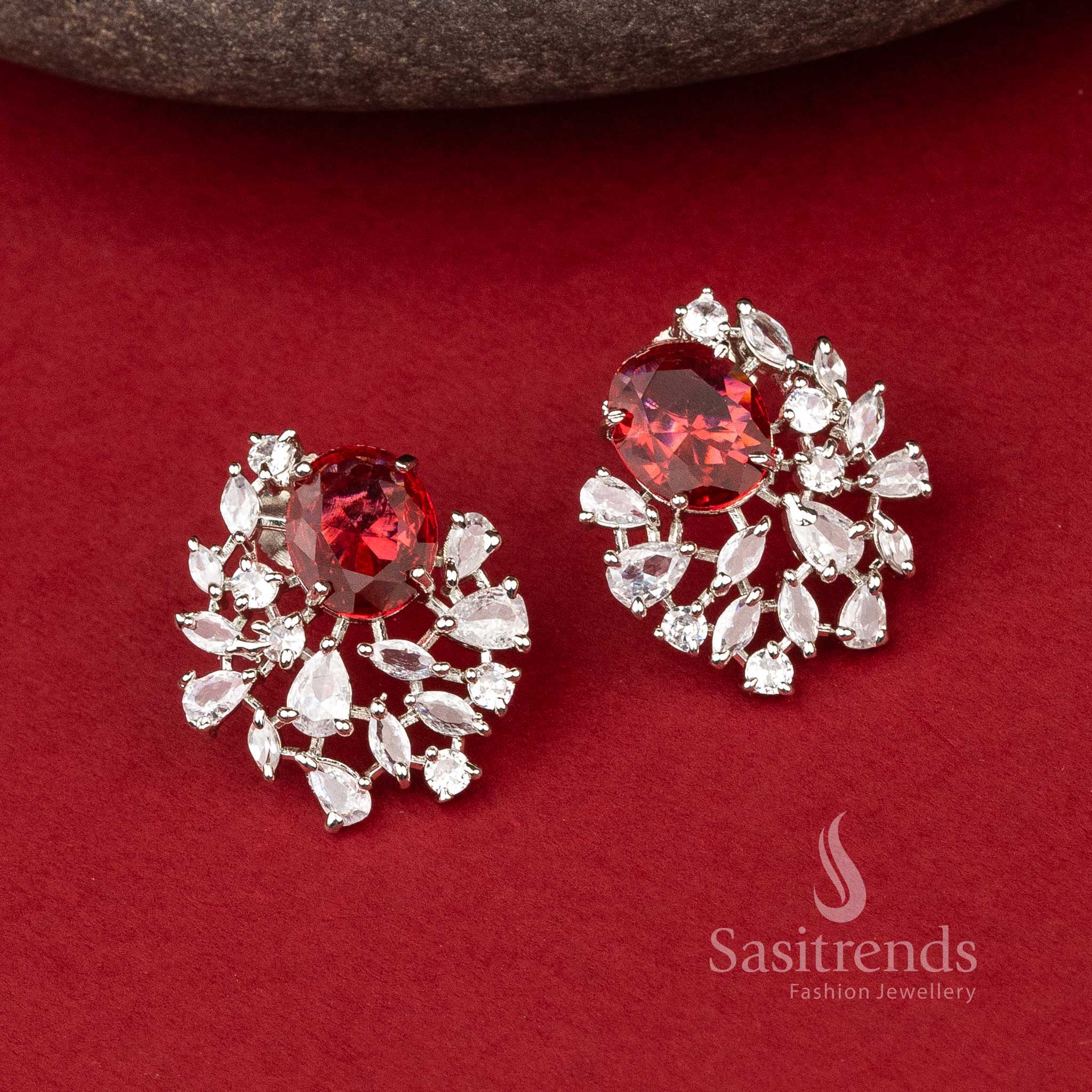  Ember Oval Glint rhodium earrings with glowing red stones in an oval-top design – elegant AD party jewellery – Sasitrends