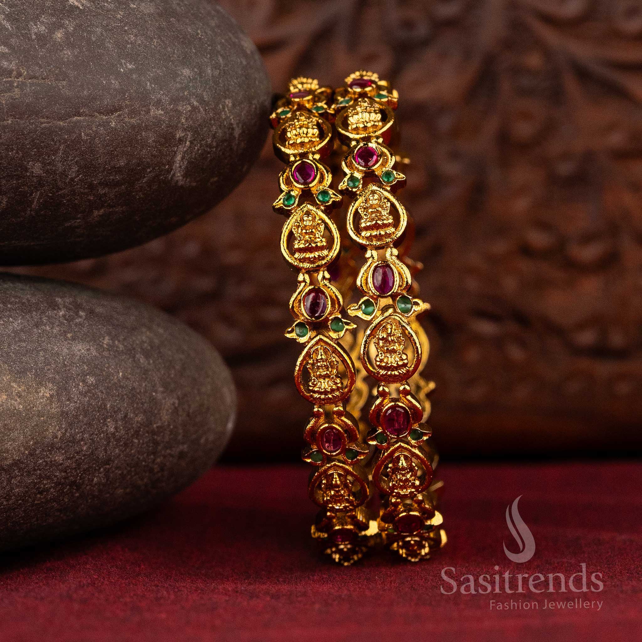 Matte gold bangles with Lakshmi motifs and colored gemstone accents, adding a touch of brilliance and tradition to your attire - Sasitrends