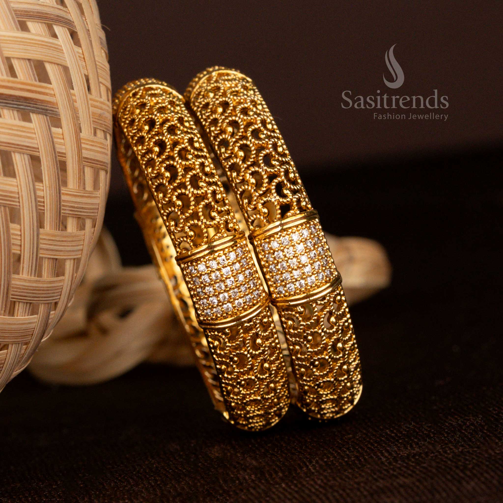 Grand matte gold-plated temple bangles, embedded with White stones and dazzling AD embellishments, featuring fine filigree cutwork for a regal ethnic look - Sasitrends