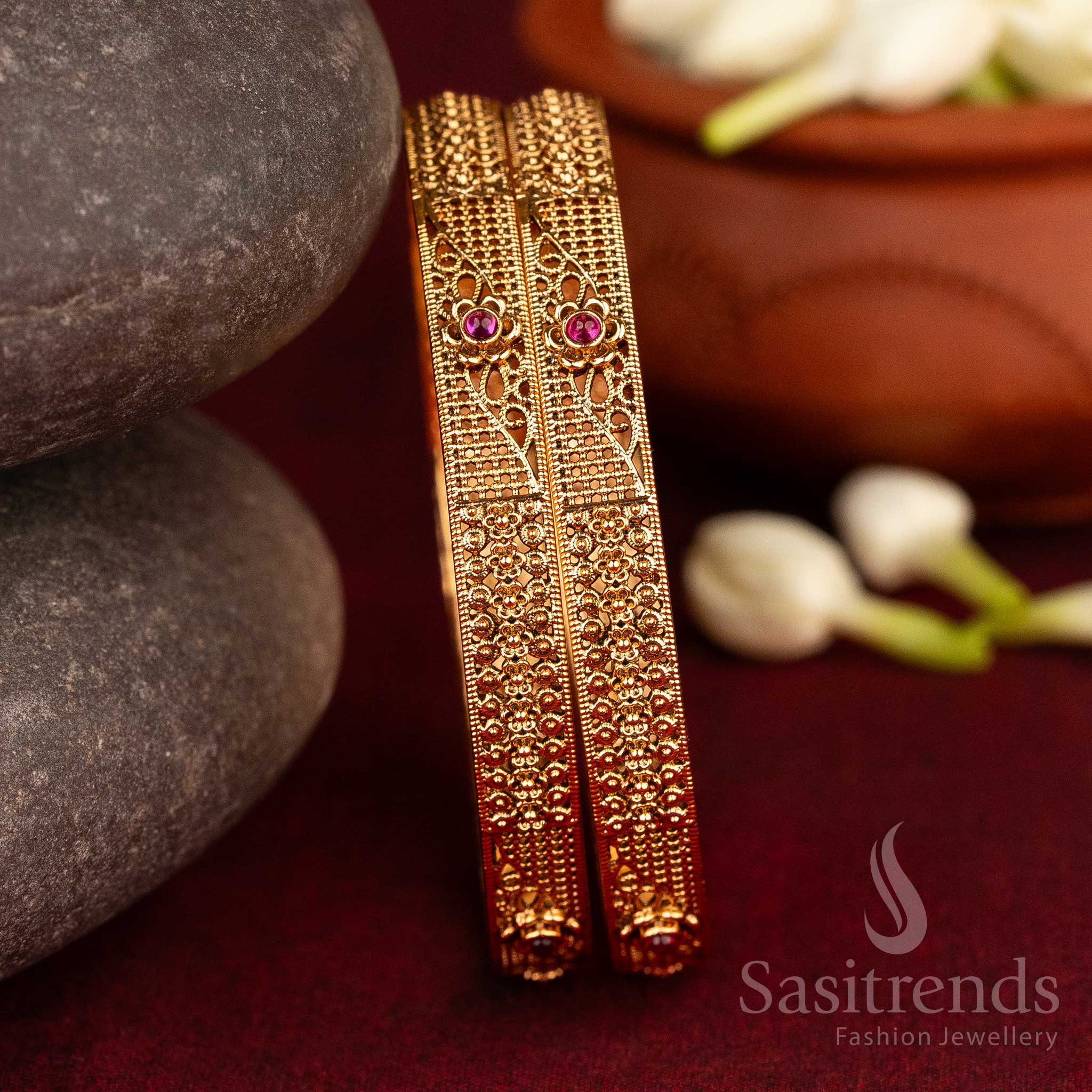Traditional antique bangles in matte gold featuring ruby AD Kemp stones and artistic floral-geometry inspired motifs – a classic jewellery treasure handcrafted for cultural sophistication by Sasitrends