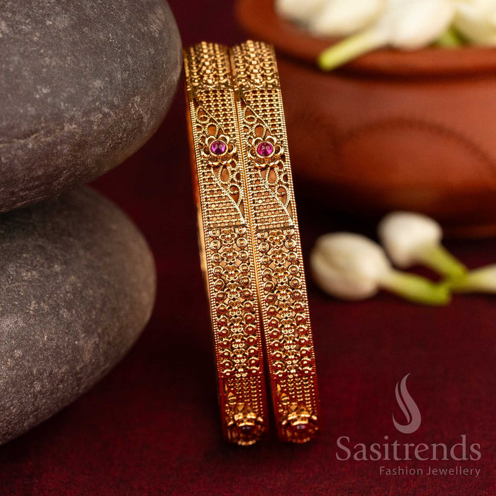 Traditional antique bangles in matte gold featuring ruby AD Kemp stones and artistic floral-geometry inspired motifs – a classic jewellery treasure handcrafted for cultural sophistication by Sasitrends