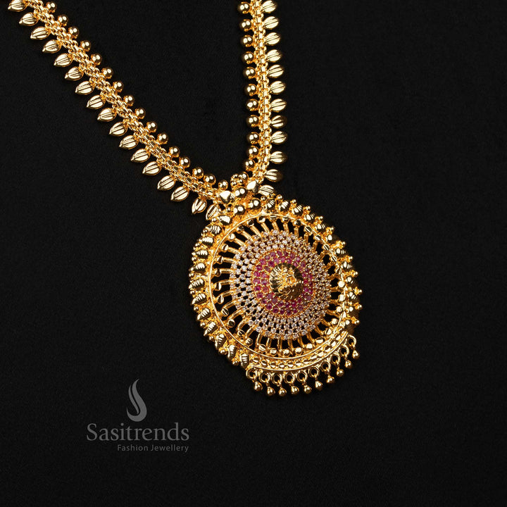 Divine white-ruby micro gold-plated long haram necklace with Lakshmi pendant, delicate leaf detailing and shimmering American Diamond stones – A glorious temple jewellery piece for bridal or festive elegance – Sasitrends