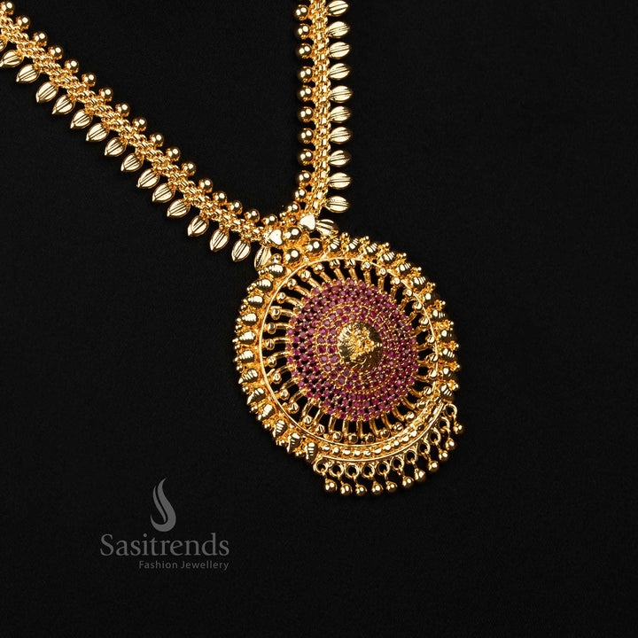 Vivid ruby-hued haram necklace with shimmering AD stones and micro gold finish, centred around a divine Lakshmi pendant and leafy design – A bold statement of heritage – Sasitrends