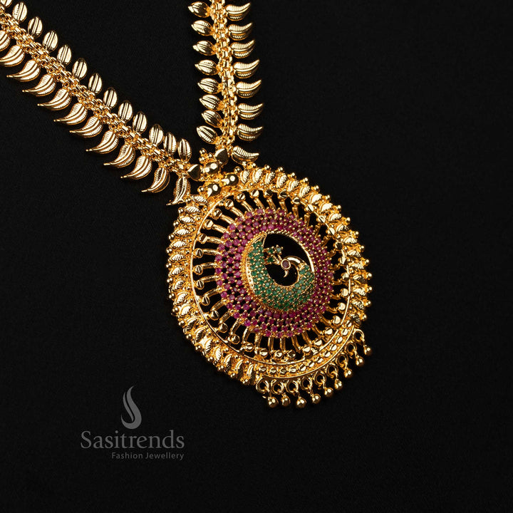 Regal ruby-green long haram with majestic peacock pendant and intricate leaf carvings in one gram micro gold plating – A magnificent piece for traditional wear – Sasitrends