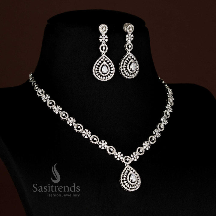 Detailed view of sparkling American Diamond rhodium plated necklace with intricate linked design and teardrop pendant - Sasitrends