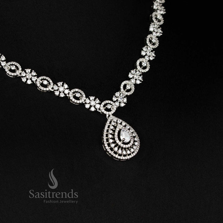 Detailed view of sparkling American Diamond rhodium plated necklace with intricate linked design and teardrop pendant - Sasitrends
