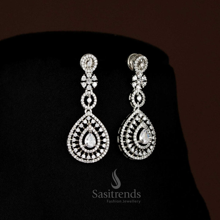 Full view of elegant American Diamond rhodium silver plated jewellery set, including necklace with teardrop pendant and matching earrings, perfect for grand occasions.