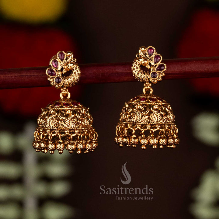 Premium Temple Matte Gold Plated Royal Peacock Jhumka Earrings with Ghungroo Charm Drops For Special Occasions