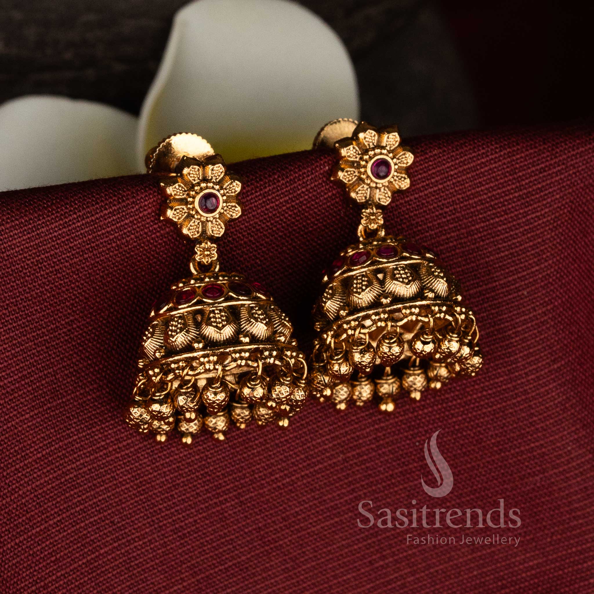 Heritage high-quality matte gold plated floral stud screw type jhumka earrings with intricate detailing