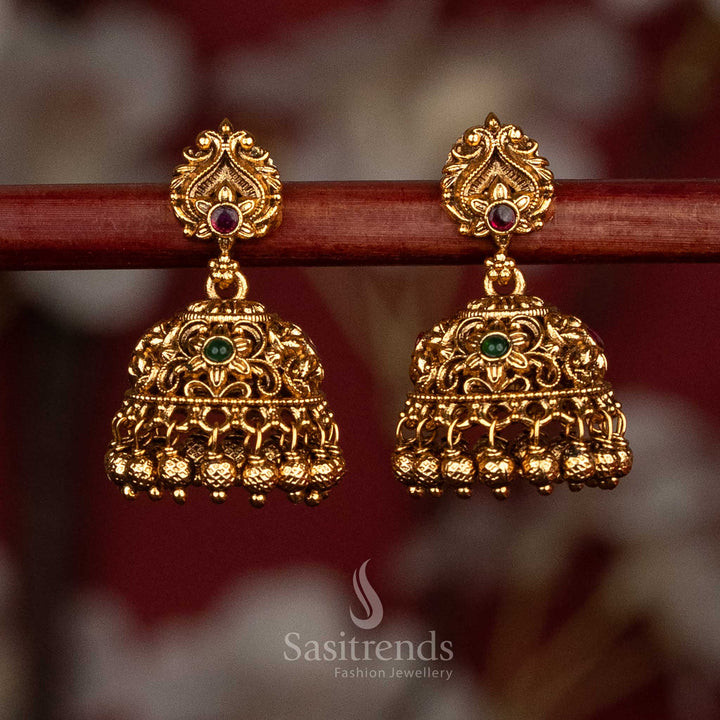 Divine heritage matte gold plated ruby green peacock floral filigree jhumkas with golden ghungroo detailing for temple festive jewellery - Sasitrends