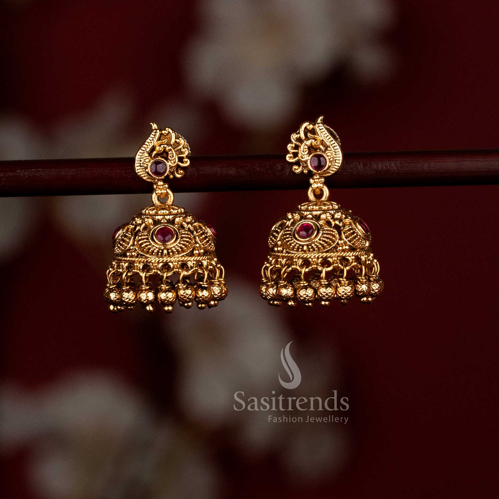 Ornate ruby temple matte gold peacock jhumka earrings with intricate golden beads, excellent choice for temple visits, wedding ceremonies, and ethnic celebrations - Sasitrends