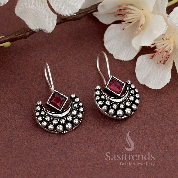Crescent frame oxidised earrings with bold red square stone, a striking pick for casual and lightwear outfits – Sasitrends