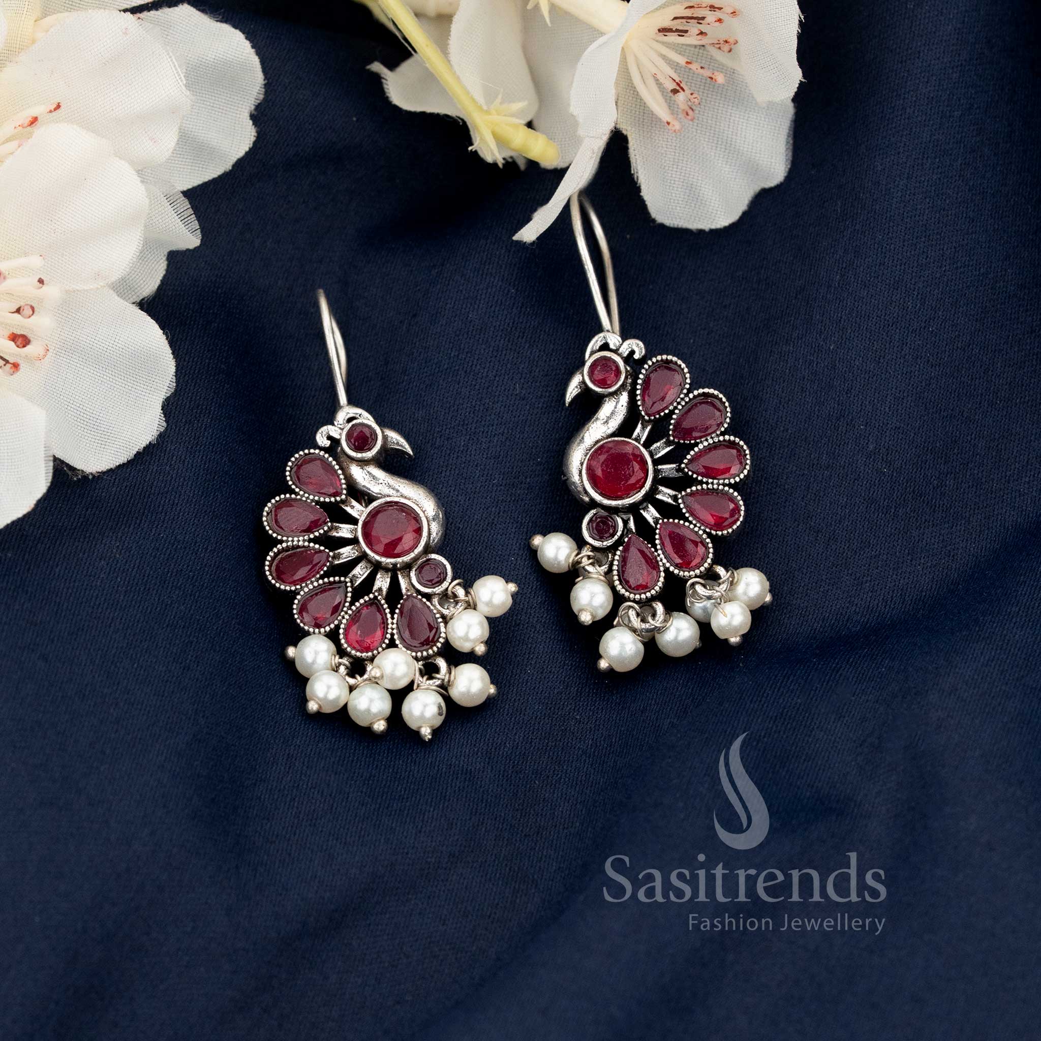 Ruby Oxidised Peacock Motif Fish Hook Earrings with Hanging Pearls - Sasitrends 