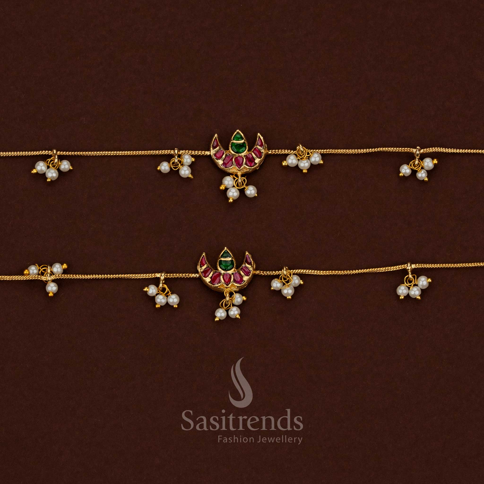 
Traditional 24K jadau gold plated kundan stone anklet showcasing a collection of crescent moon designs with pearl hangings - Sasitrends
