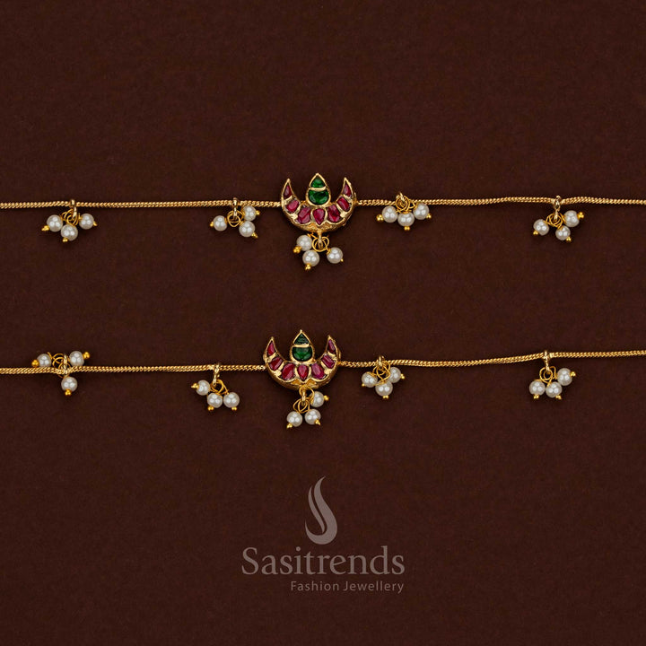 
Traditional 24K jadau gold plated kundan stone anklet showcasing a collection of crescent moon designs with pearl hangings - Sasitrends
