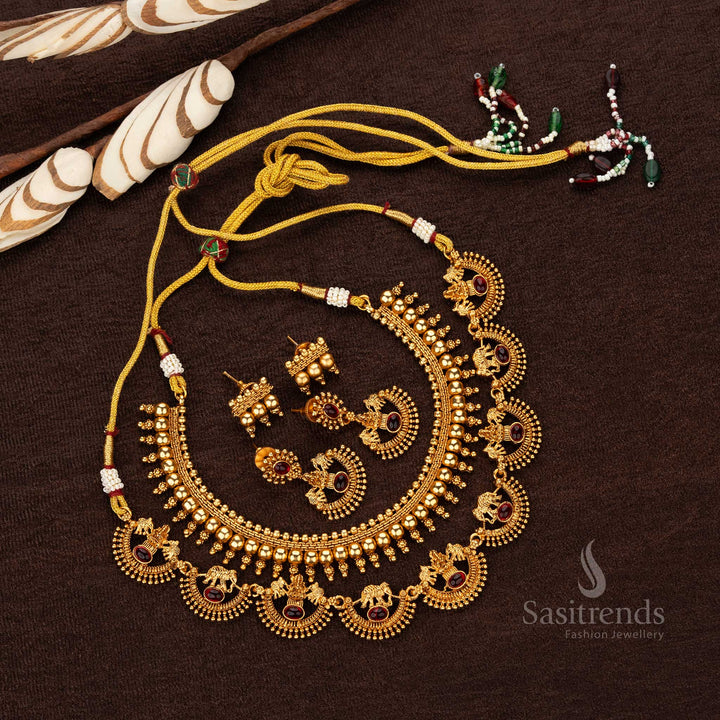 Temple combo jewellery with Lakshmi seated on lotus, elephant motifs, and ruby stones - Sasitrends