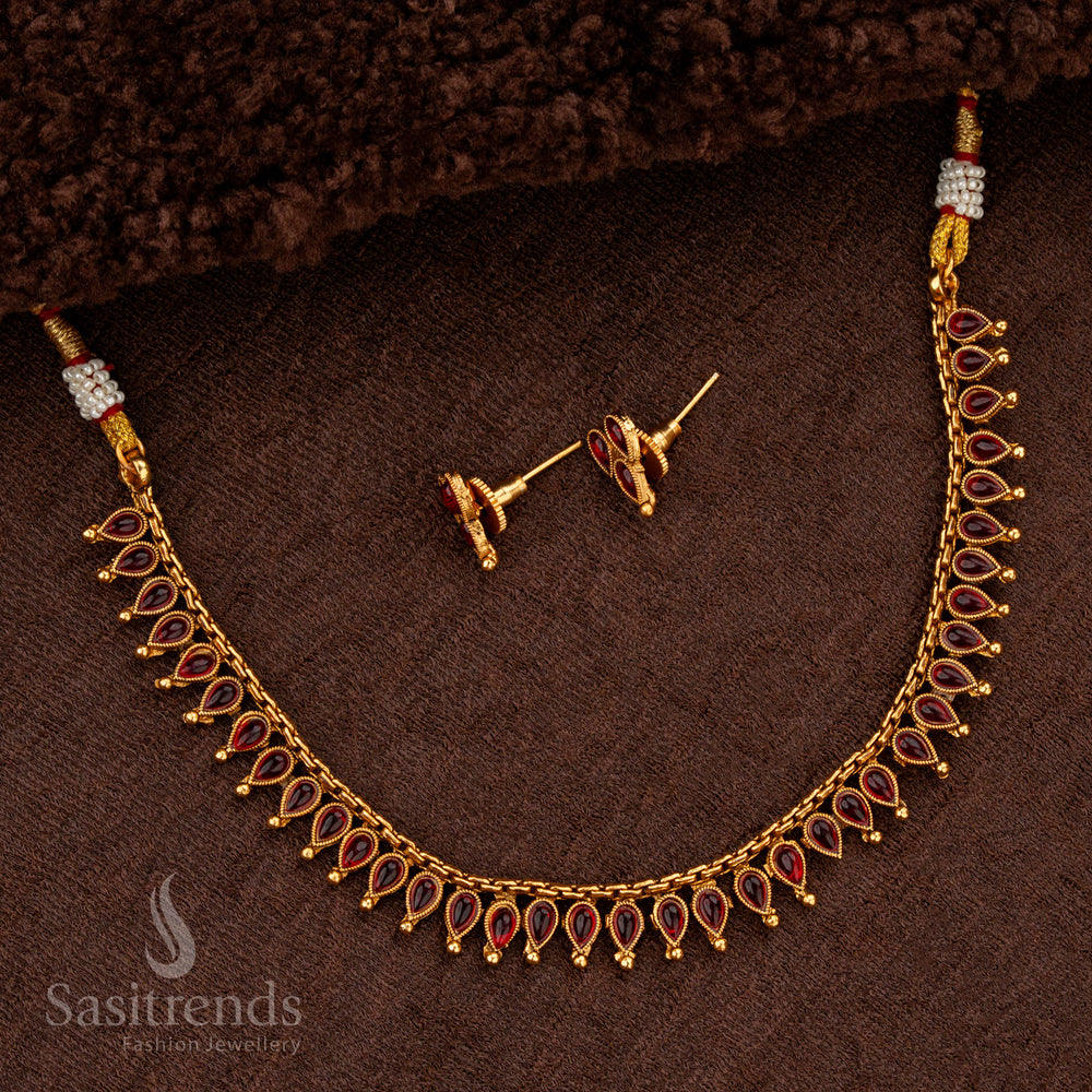 Classic matte gold necklace with ruby stones and golden ball accents - Sasitrends