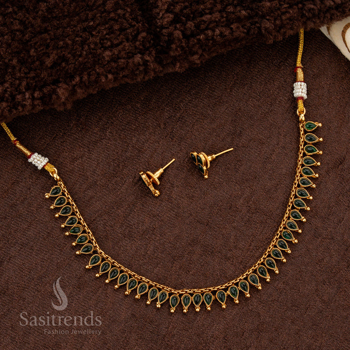 Classic matte gold necklace with green stones and golden ball accents - Sasitrends