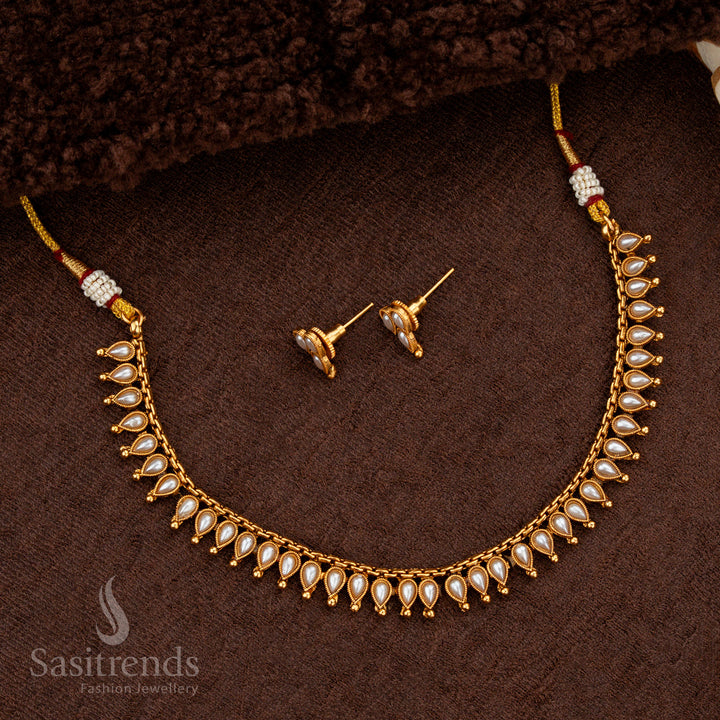 Classic matte gold necklace with white stones and golden ball accents - Sasitrends