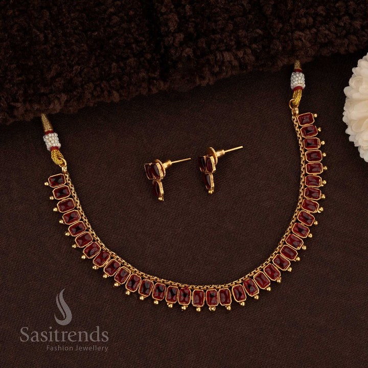 Gorgeous Classic Matte Gold Necklace Jewellery Set Adorned With Rectangular Kemp Stones In Ruby Colour, Featuring Matte Gold Plating, Artistic Detailing, And A Grand Finish Ideal For Bridal And Party Wear Styling – Sasitrends