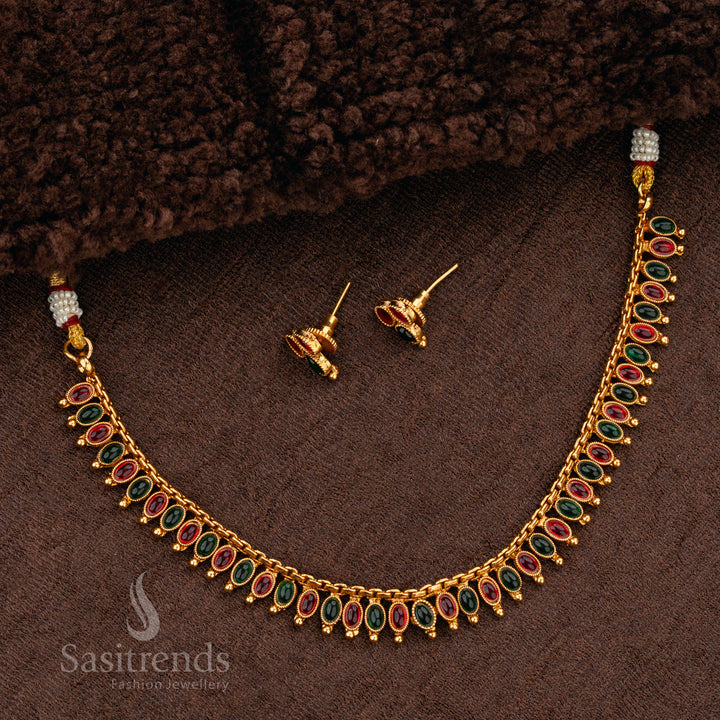Luxurious ruby-green stone matte gold plated necklace set, featuring an ornate handcrafted finish, making it a regal choice for bridal jewellery - Sasitrends