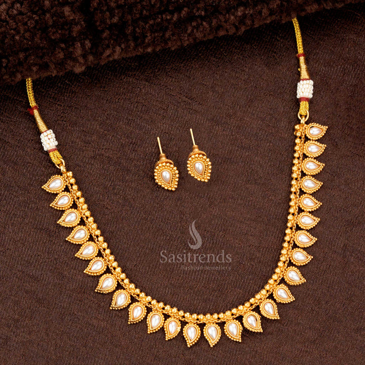Traditional necklace set with pearl teardrop motifs and matching earrings, perfect for weddings and festive occasions - Sasitrends