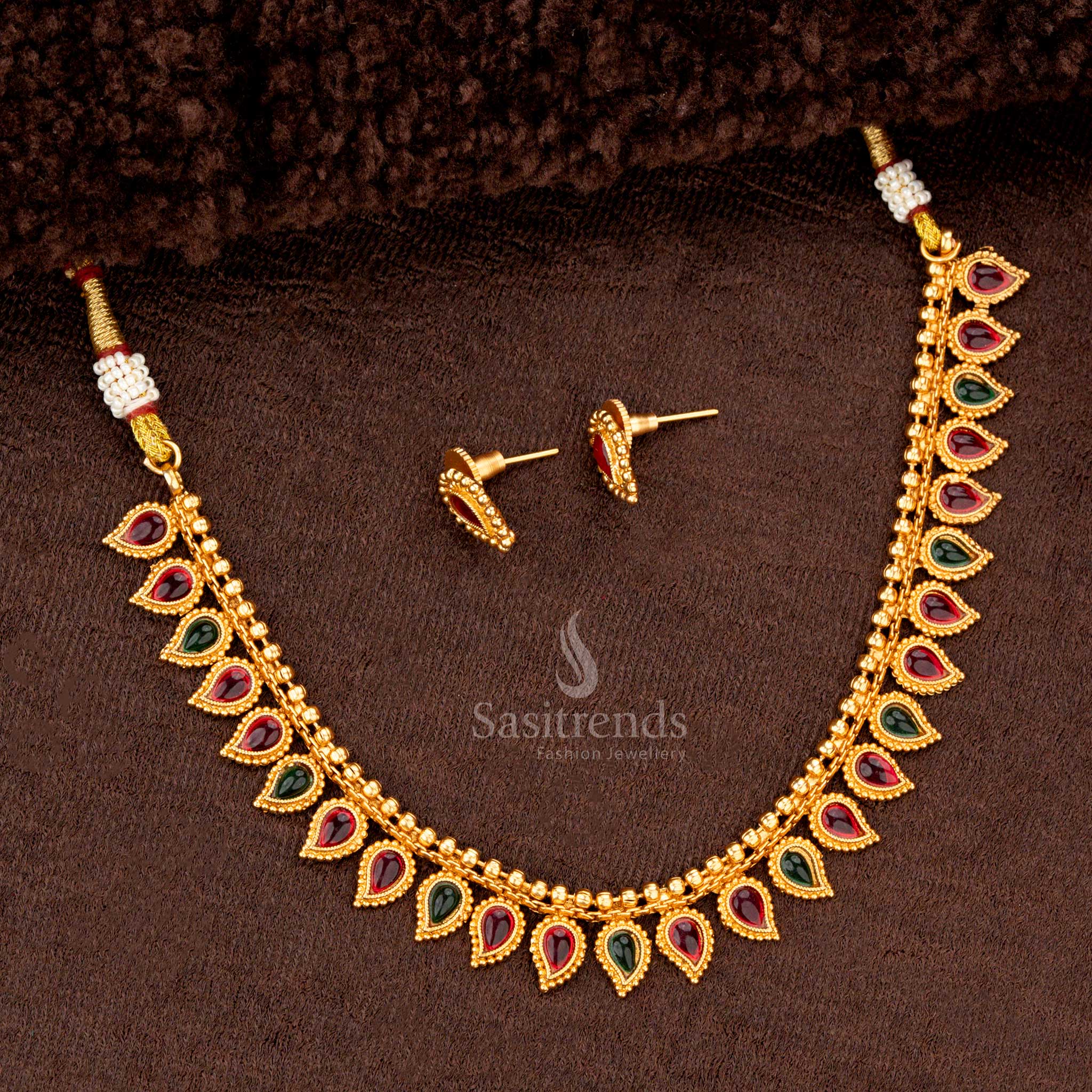 Beautiful ruby and green combination teardrop necklace set with matching earrings for festive occasions - Sasitrends
