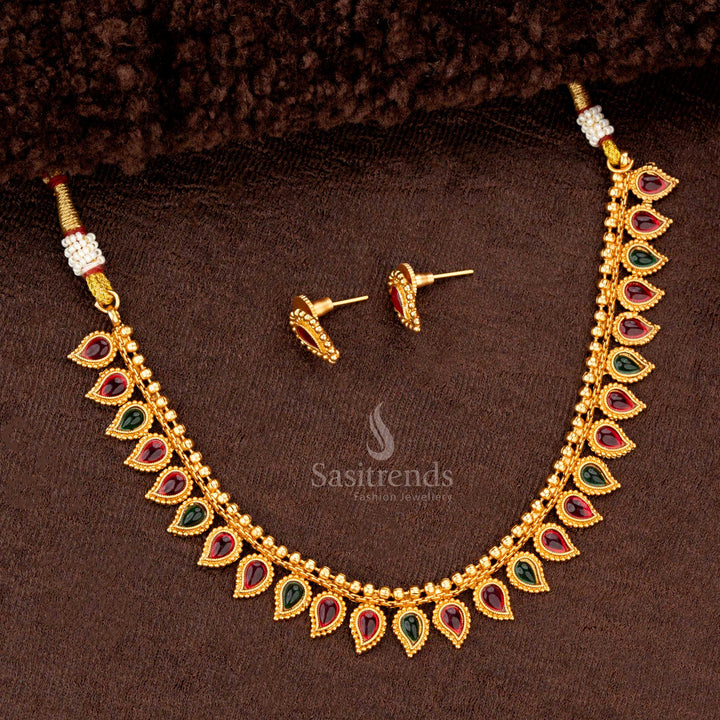 Beautiful ruby and green combination teardrop necklace set with matching earrings for festive occasions - Sasitrends