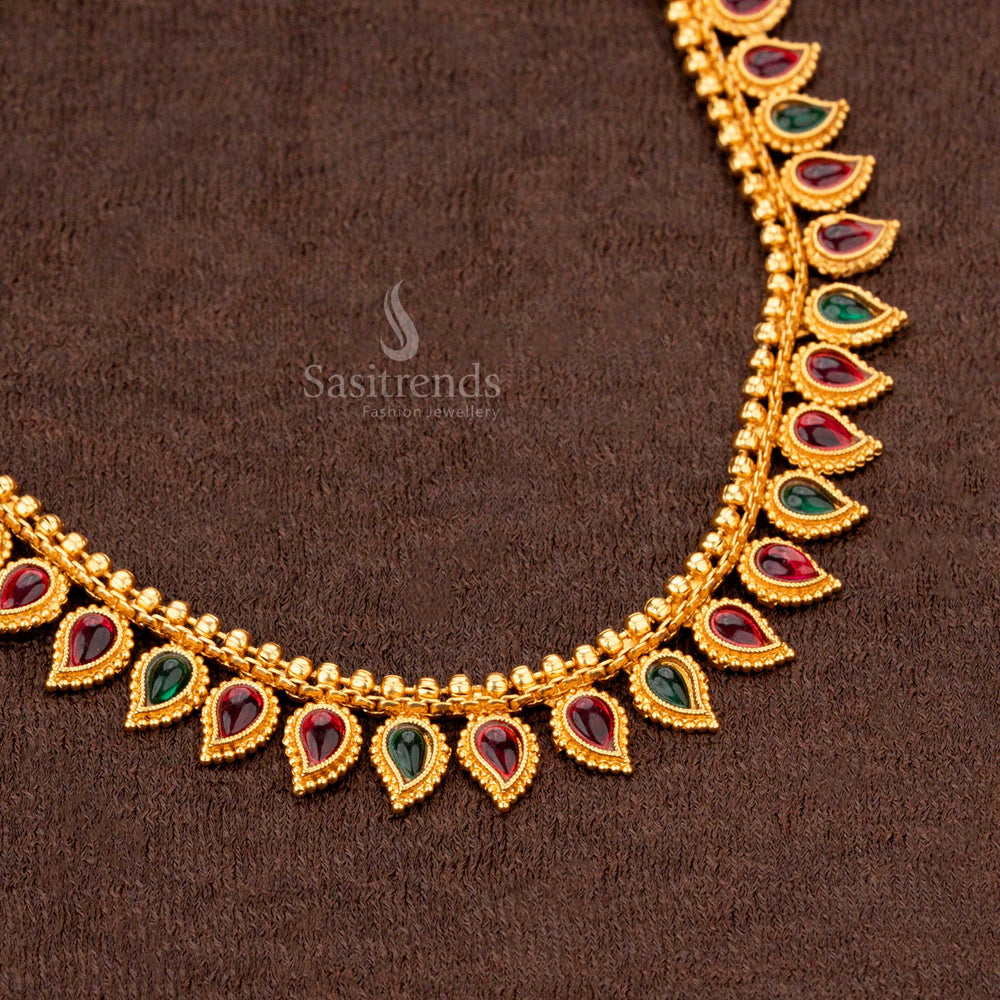 Traditional ruby and green teardrop motif necklace with earrings, perfect for weddings and ethnic wear - Sasitrends
