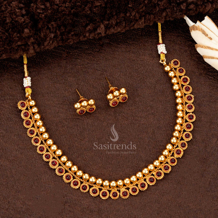 Matte gold-plated temple jewellery with ruby beads and accents Classic beaded necklace set with ruby highlights for festive wearn - Sasitrends
