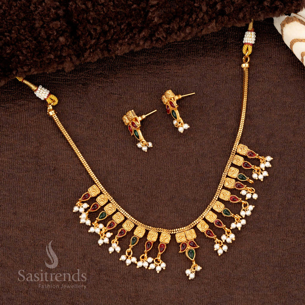 Ruby-green temple jewellery with pearl drops, square motifs, and gold beadwork - Sasitrends
