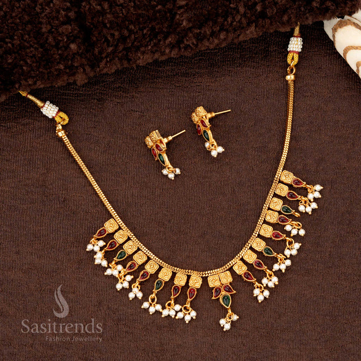 Ruby-green temple jewellery with pearl drops, square motifs, and gold beadwork - Sasitrends