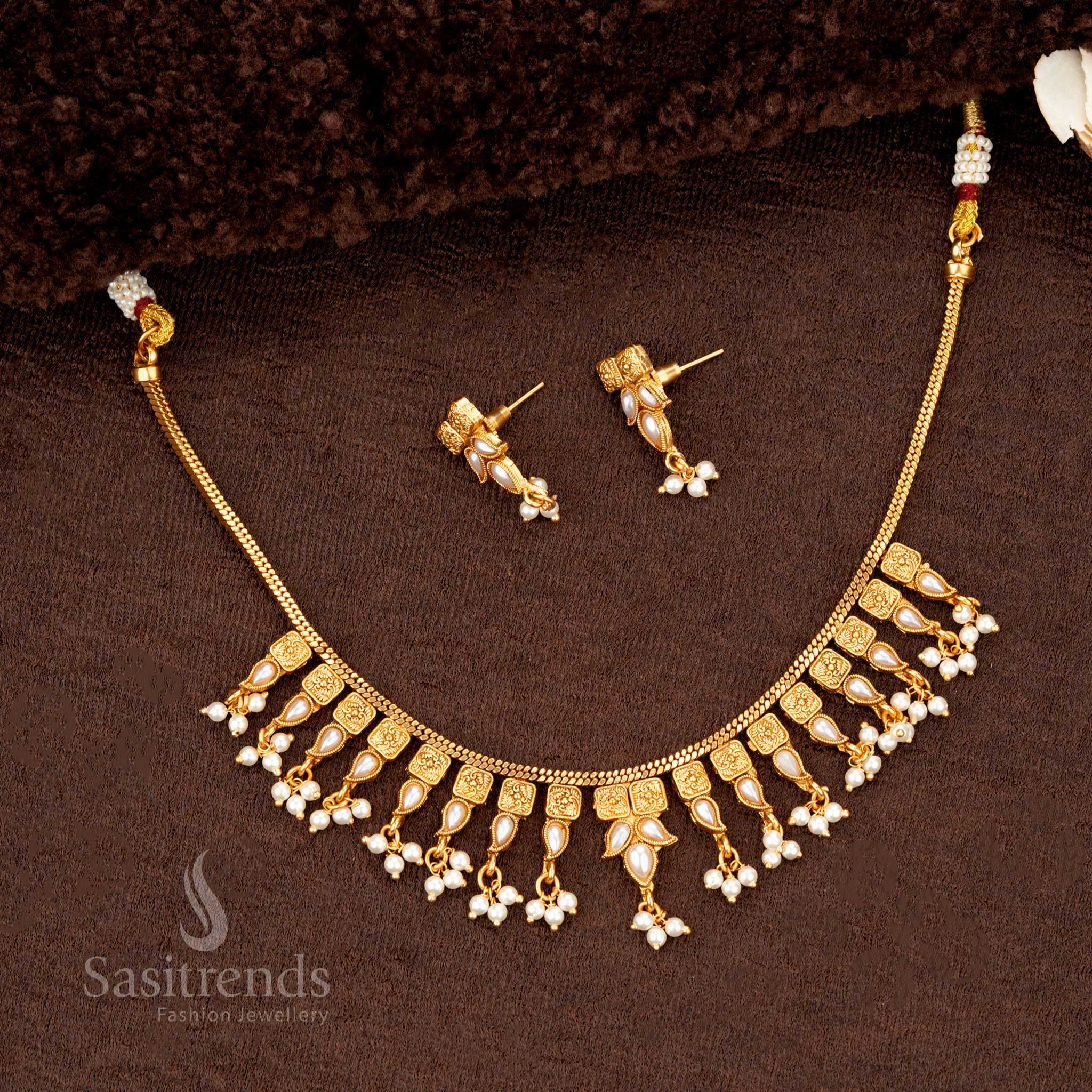 Pearl-accented temple jewellery featuring elegant drop-shaped detailing - Sasitrends