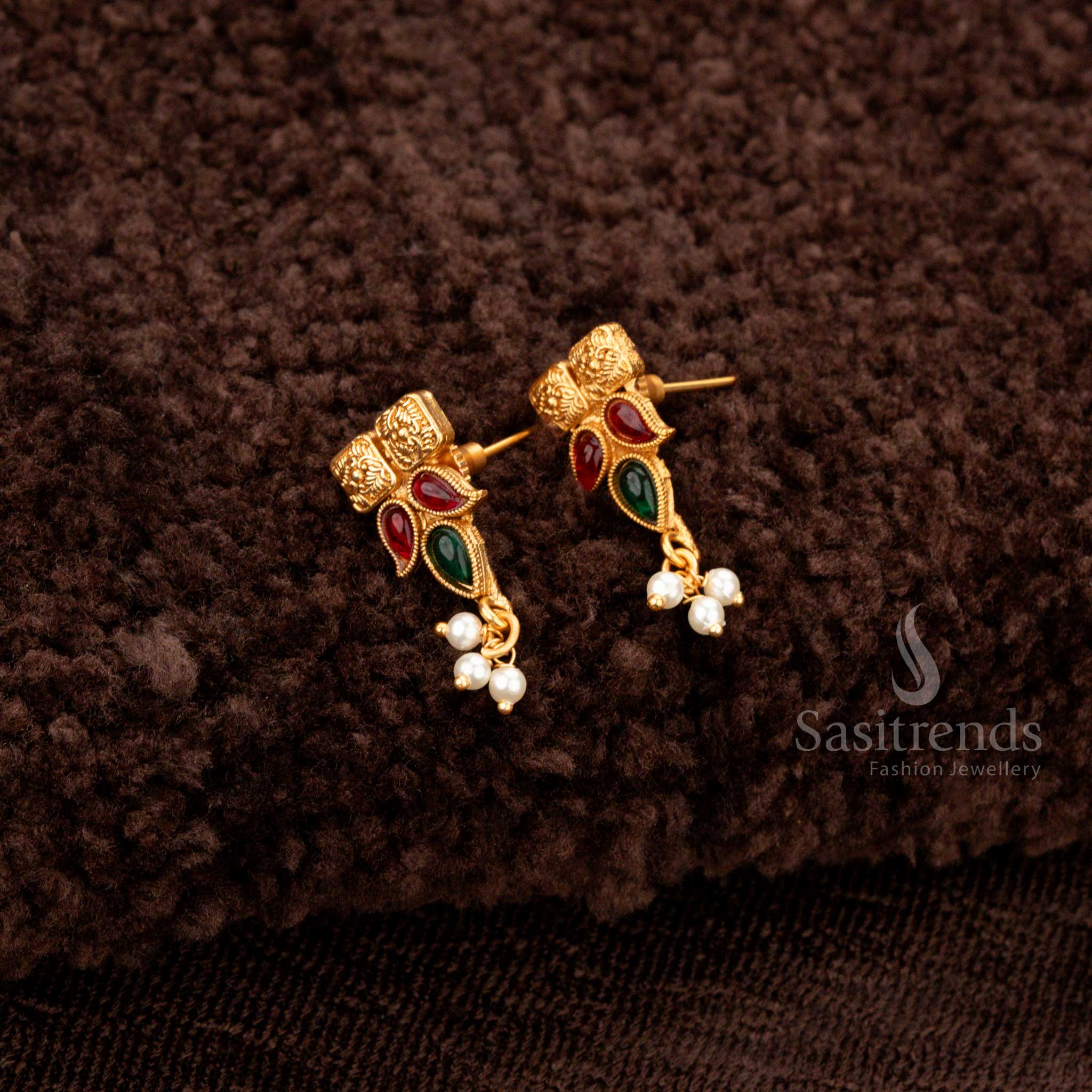 Ruby-green temple jewellery with pearl drops, square motifs, and gold beadwork - Sasitrends