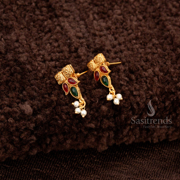 Ruby-green temple jewellery with pearl drops, square motifs, and gold beadwork - Sasitrends