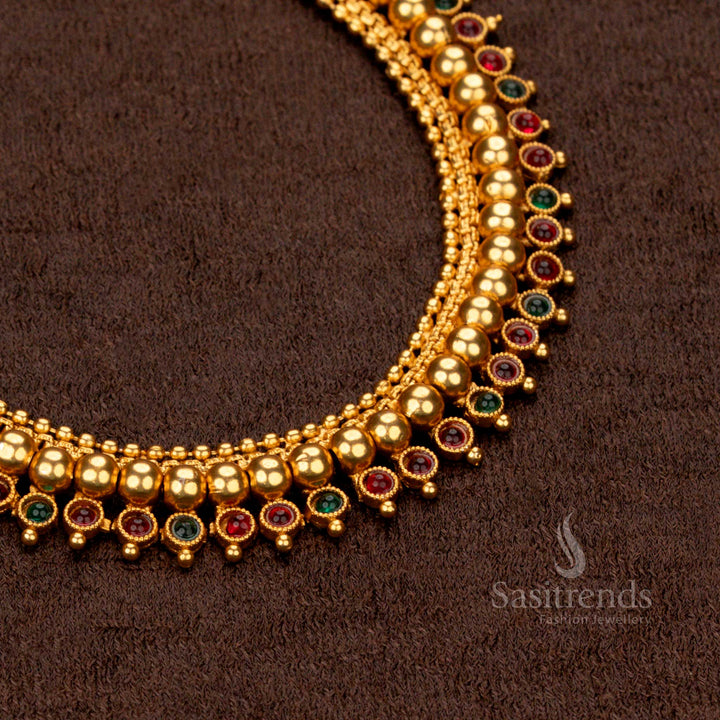 Matte gold-plated temple necklace featuring layered round motifs and polished bead accents - Sasitrends