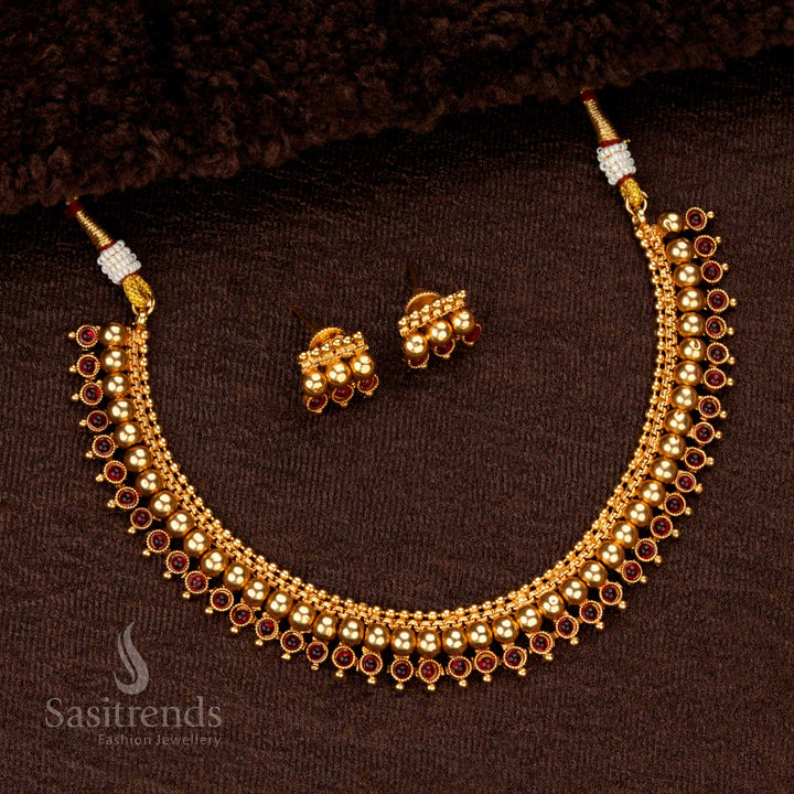 Classic round motif temple necklace with polished gold beads and ruby-green accents - Sasitrends