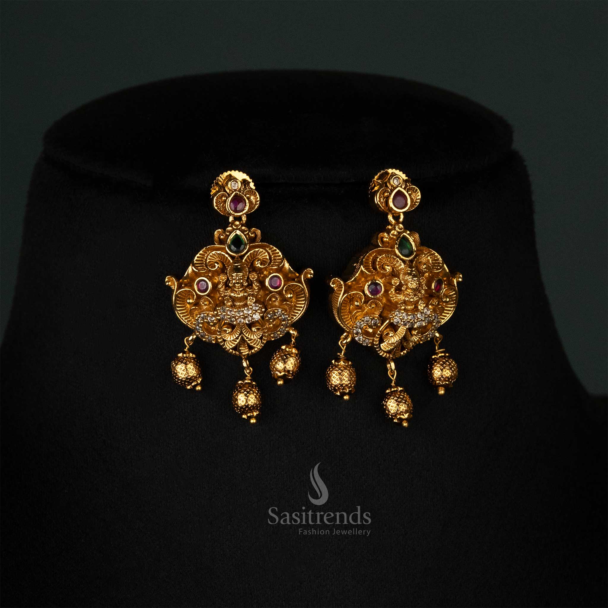 Heritage temple-style necklace with a matte gold finish, Lakshmi pendant, peacock motifs, and bead adornments - Sasitrends