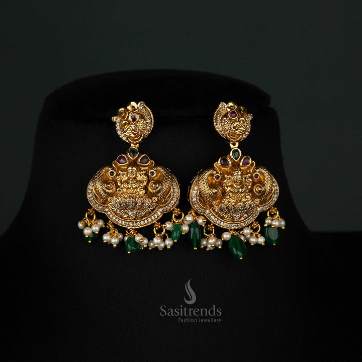 Grand temple matte gold-plated Earrings set featuring dual pendants, peacock motifs, green beads, pearls - Sasitrends