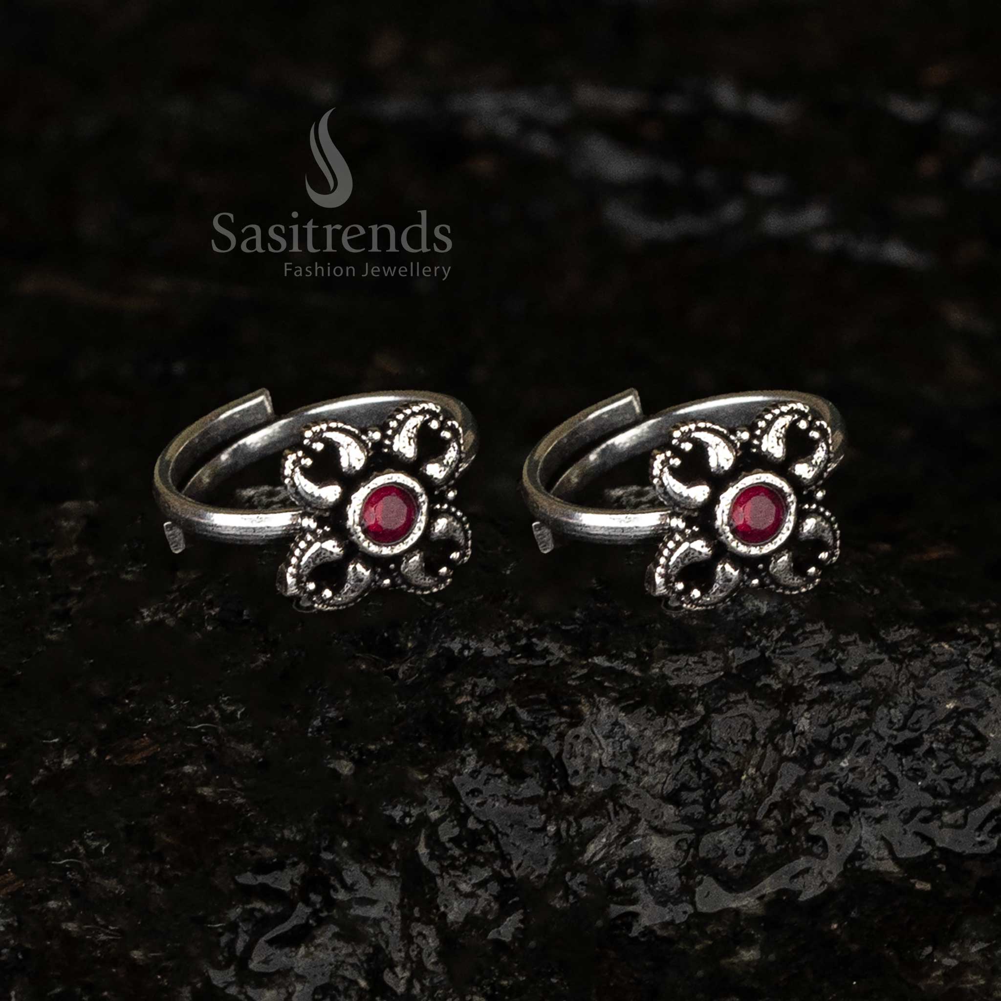 Stunning oxidised floral toe rings with ruby hues, featuring intricate designs for a bold and sophisticated look - Sasitrends