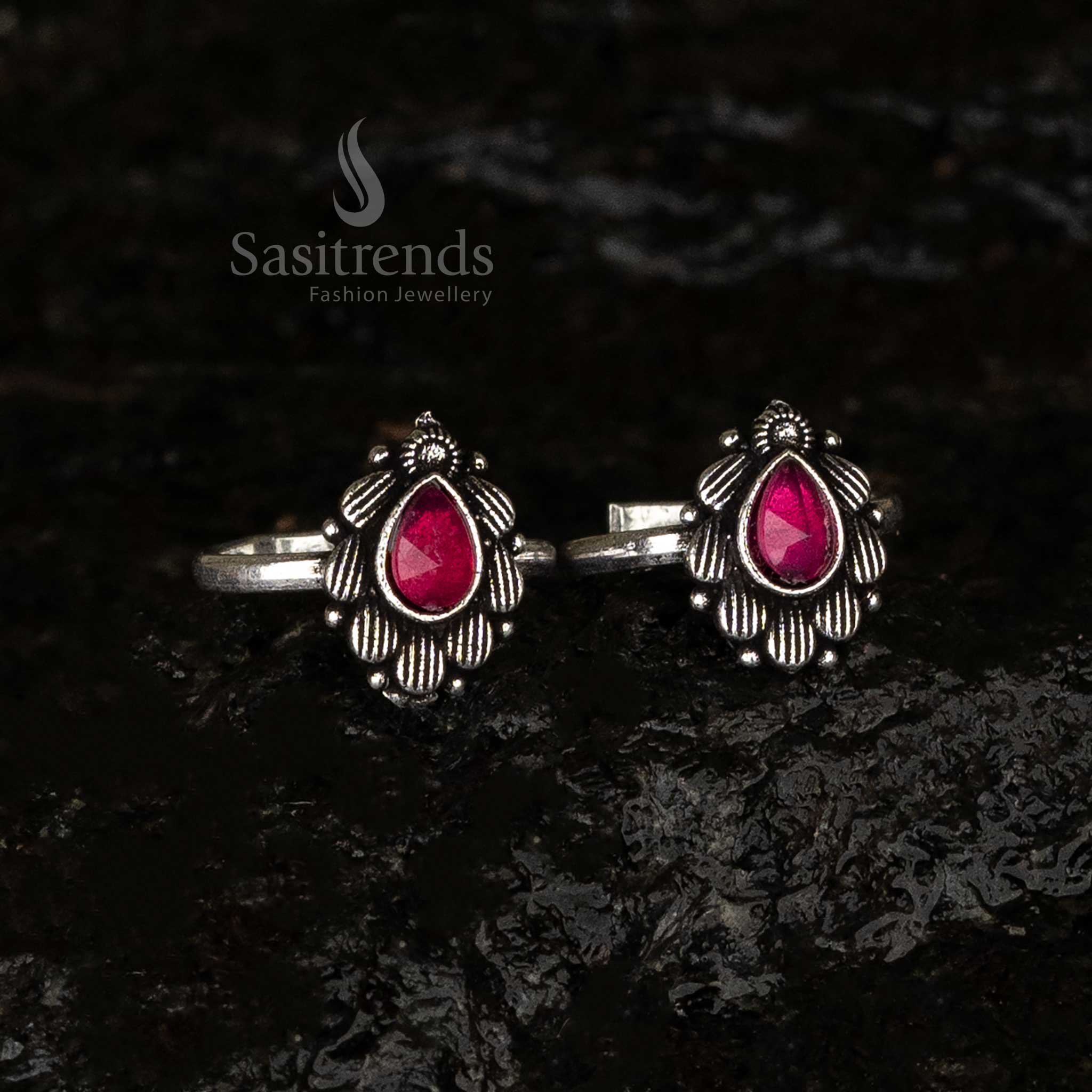 Vibrant ruby teardrop toe ring with oxidised petal motif and adjustable band - Sasitrends