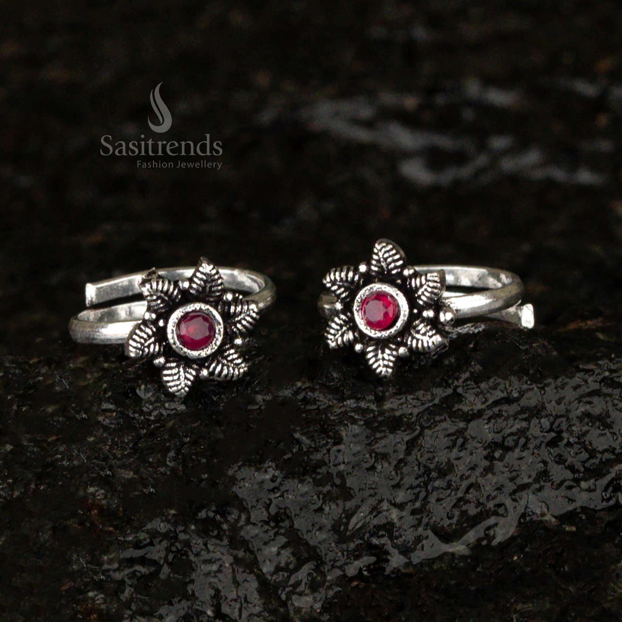 Oxidised antique-style toe ring with a fiery red ruby glass stone and delicate leaf design, blending bold elegance with vintage craftsmanship - Sasitrends