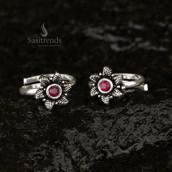 Oxidised antique-style toe ring with a fiery red ruby glass stone and delicate leaf design, blending bold elegance with vintage craftsmanship - Sasitrends