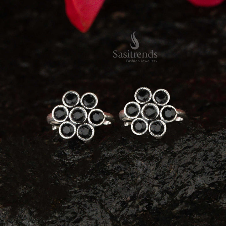 Oxidised silver toe ring with a midnight black stone set in a floral motif, capturing the essence of a vintage midnight bloom - Sasitrends