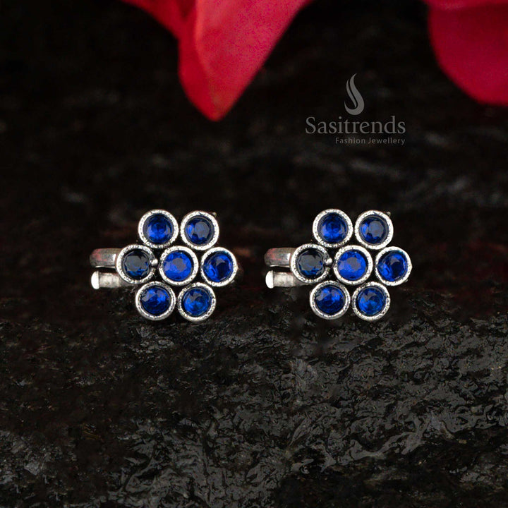 Oxidised flower toe ring with a celestial blue gemstone and detailed petals, finished in a classic antique style - Sasitrends