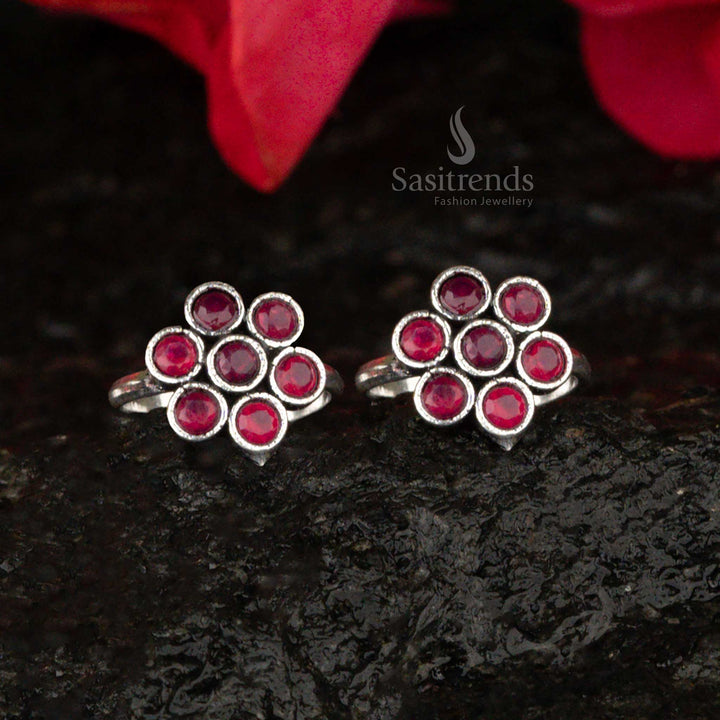 Oxidised toe ring featuring a ruby center gem in a floral petal design, showcasing regal red elegance - Sasitrends