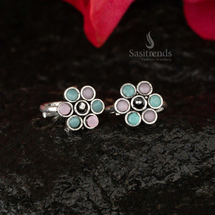 Oxidised toe ring featuring mint green and pink stones in a charming floral pattern, exuding a soft pastel glow - Sasitrends