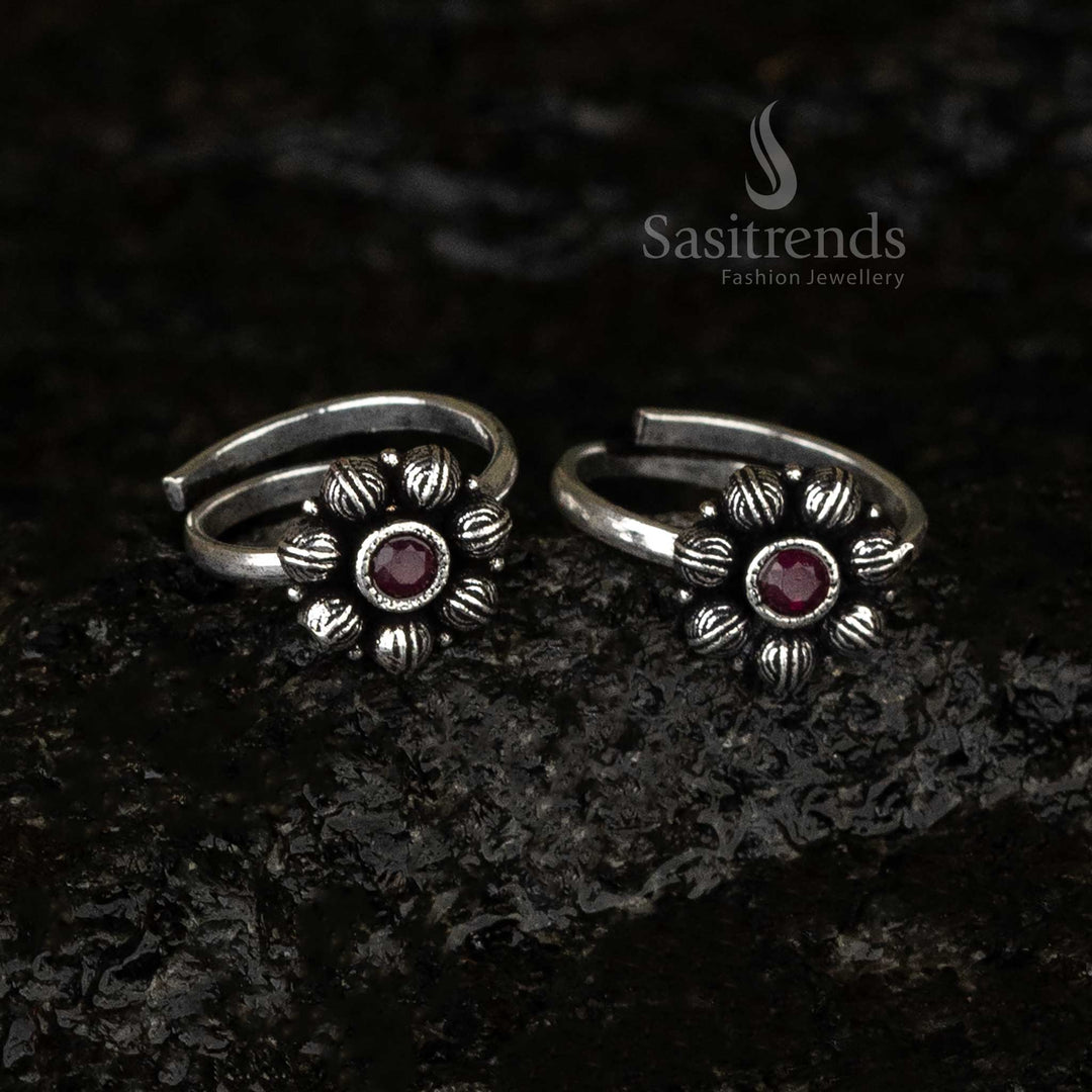 Oxidised round toe ring featuring a radiant ruby stone in a floral petal design, exuding regal antique charm and bold sophistication - Sasitrends