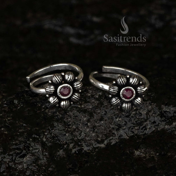 Oxidised round toe ring featuring a radiant ruby stone in a floral petal design, exuding regal antique charm and bold sophistication - Sasitrends